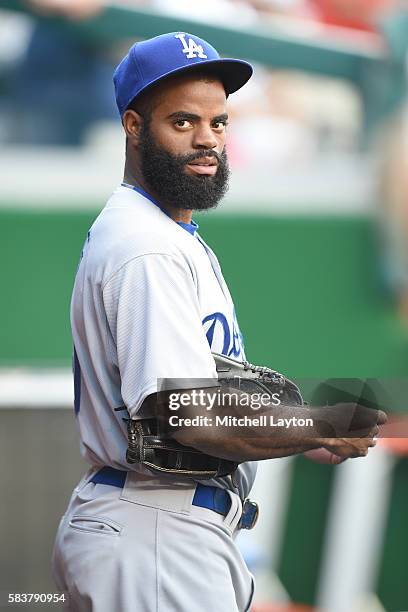 Andrew Toles of the Los Angeles Dodgers looks on before a baseball game against the Los Angeles Dodgers at Nationals Park on July 19, 2016 in...