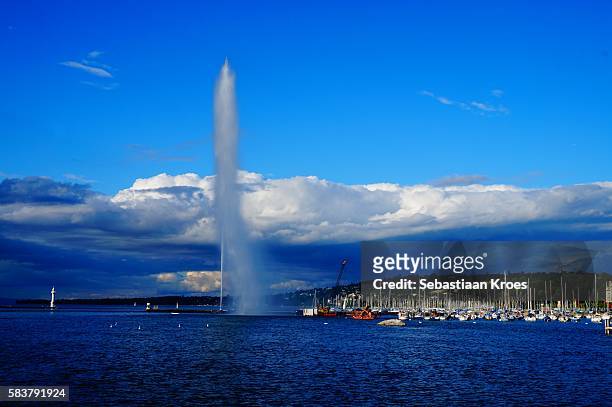 cloudy and blue sky, jet d'eau, geneva, switzerland - 1951 stock pictures, royalty-free photos & images