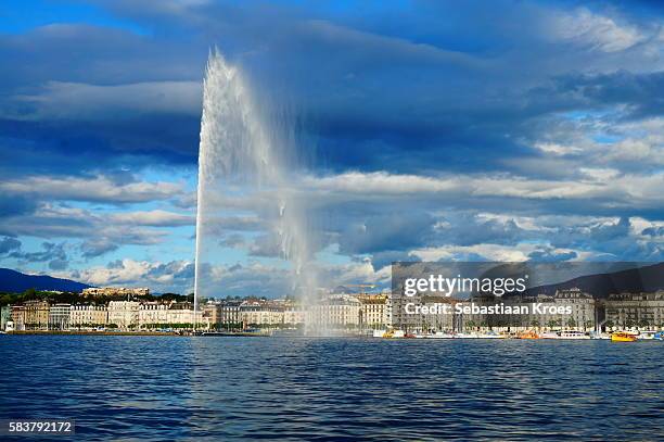 city of geneva at dusk in sunshine, jet d'eau, switzerland - ginevra foto e immagini stock