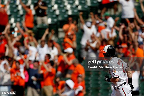 Nolan Reimold of the Baltimore Orioles hits a two run walk-off home run in the ninth inning to defeat the Cleveland Indians 5-3 at Oriole Park at...