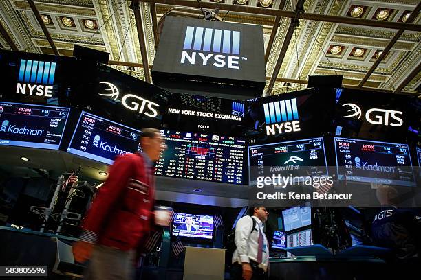 Taders works on the floor of the New York Stock Exchange during the evening of July 27, 2016 in New York City. The dollar fell Wednesday as the U.S....