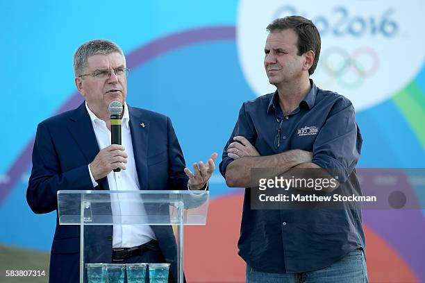 President Thomas Bach addresses the media while visiting the site of the Olympic flame with Rio de Janeiro Mayor Eduardo Paes on July 27, 2016 in Rio...