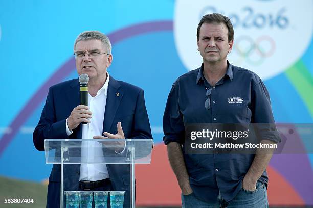 President Thomas Bach addresses the media while visiting the site of the Olympic flame with Rio de Janeiro Mayor Eduardo Paes on July 27, 2016 in Rio...