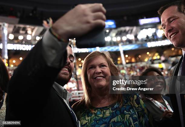 Jane O'Meara Sanders, wife of Sen. Bernie Sanders, poses for photos with delegates on the third day of the Democratic National Convention at the...