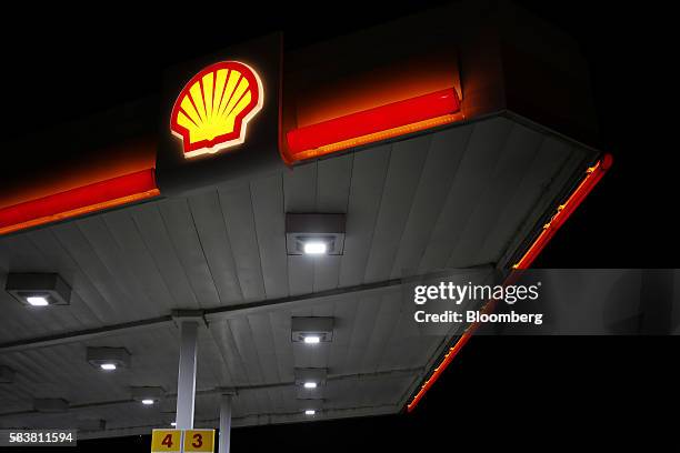 Signage is displayed at a Royal Dutch Shell PLC gasoline station in Louisville, Kentucky, U.S., on Wednesday, July 20, 2016. Royal Dutch Shell is...