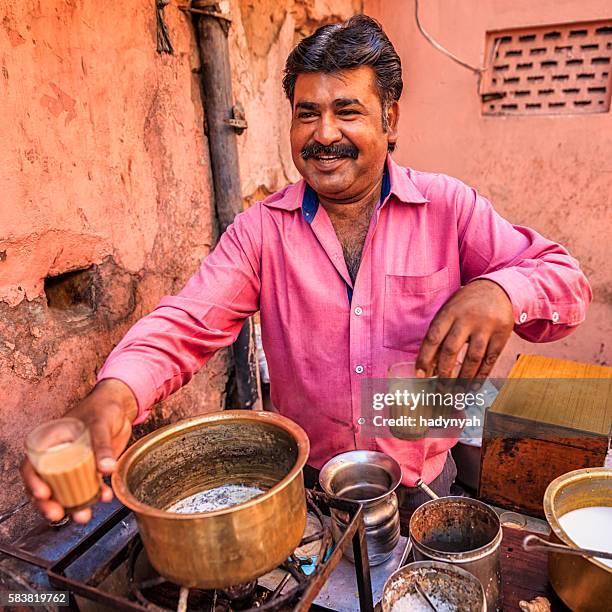 indian street seller selling tea - masala chai in jaipur - chai tea stock pictures, royalty-free photos & images