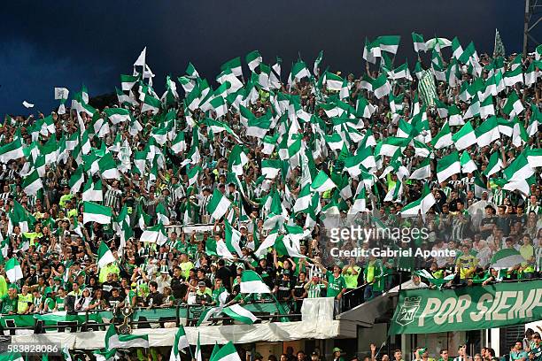 Fans of Atletico Nacional cheer for their team during a second leg final match between Atletico Nacional and Independiente del Valle as part of Copa...
