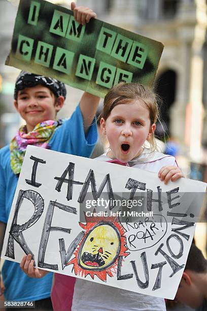 Children hold banners at a Bernie Sanders event near City Hall on day three of the Democratic National Convention on July 27, 2016 in Philadelphia,...