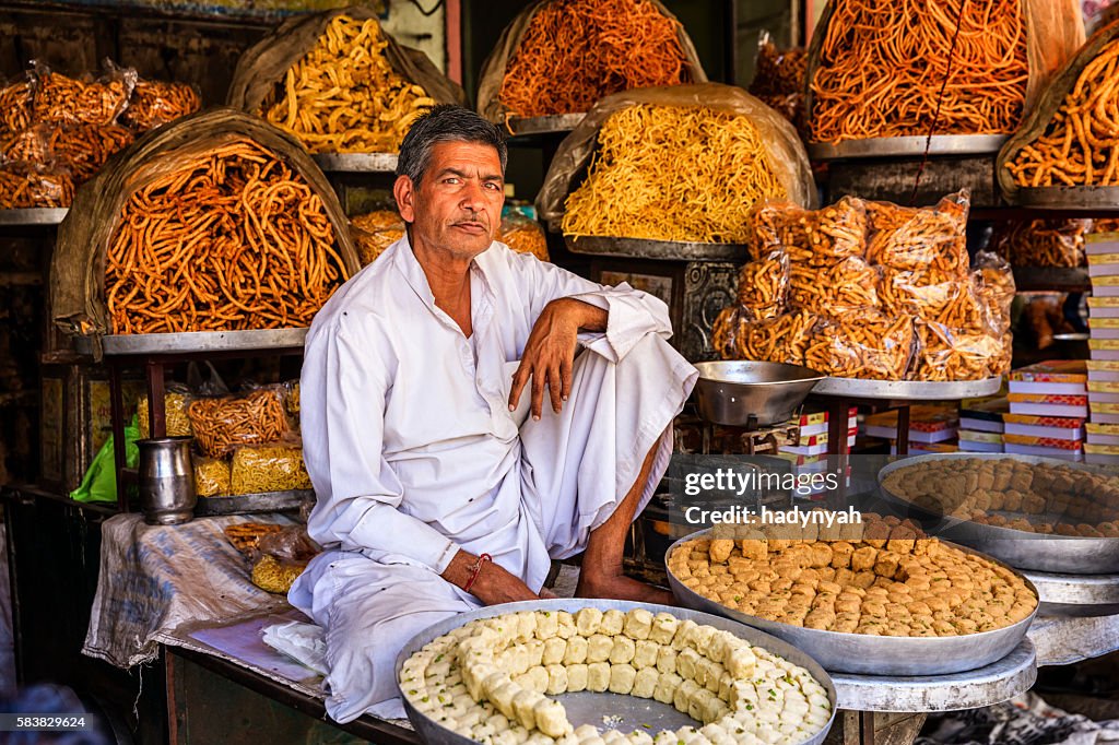 Indian street vendor selling sweets near Jaipur, India