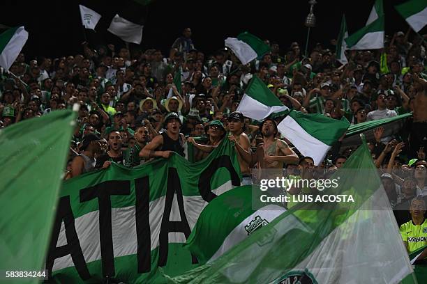 Colombian Atletico Nacional supporters cheer for their team during the Libertadores Cup final match against Ecuadorean Independiente del Valle in...