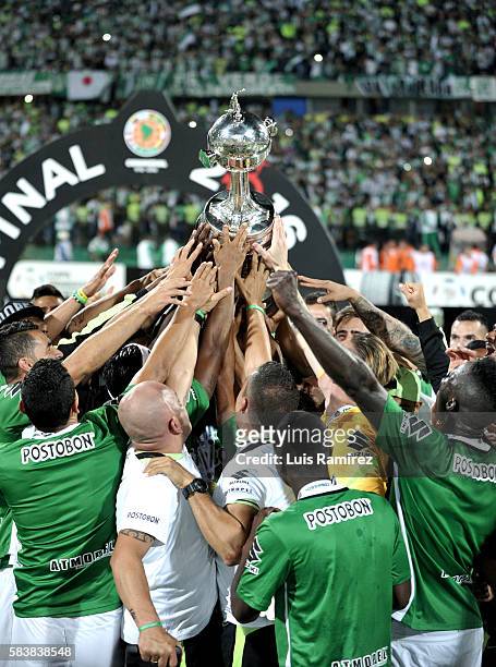 Players of Atletico Nacional lift the champions trophy after winning the final second leg match between Atletico Nacional and Independiente del Valle...