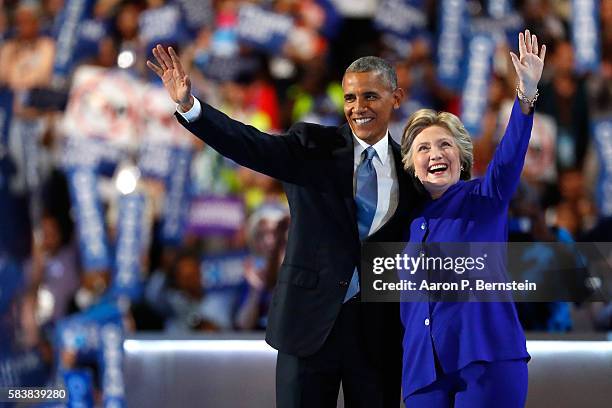 President Barack Obama and Democratic Presidential nominee Hillary Clinton wave to the crowd on the third day of the Democratic National Convention...