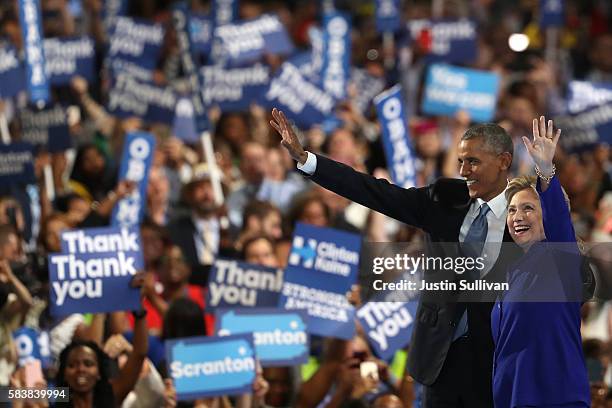 President Barack Obama and Democratic Presidential nominee Hillary Clinton wave to the crowd on the third day of the Democratic National Convention...