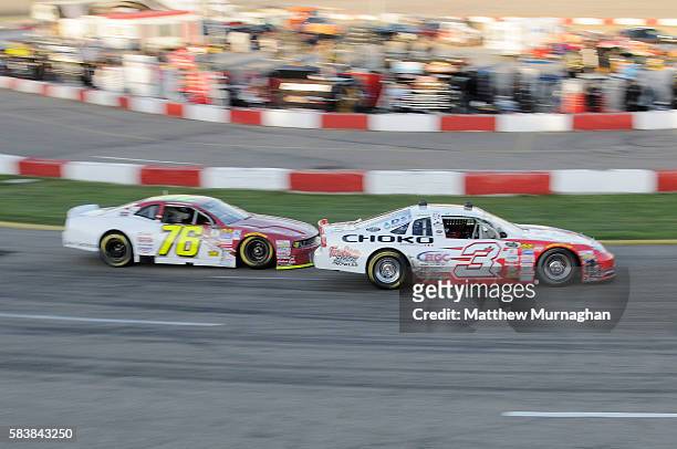 Jason Hathaway, driver of the Raybestos/Fast Eddie/Choko/HGC/DSI Chevrolet leads the race in front of Cayden Lapcevich, driver of Bay King Chysler...