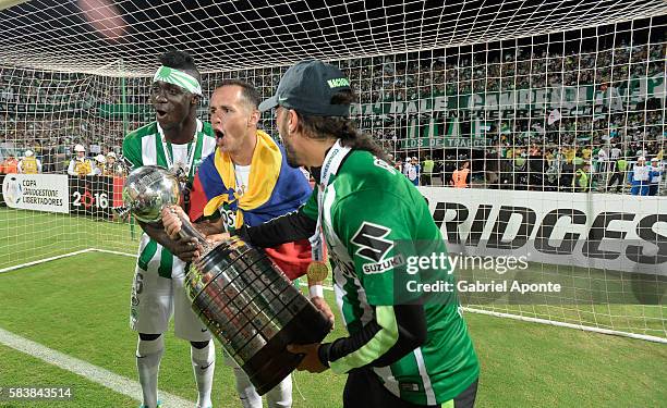 Davison Sanchez, Alejandro Guerra and Sebastian Perez of Nacional celebrate with the trophy after a second leg final match between Atletico Nacional...