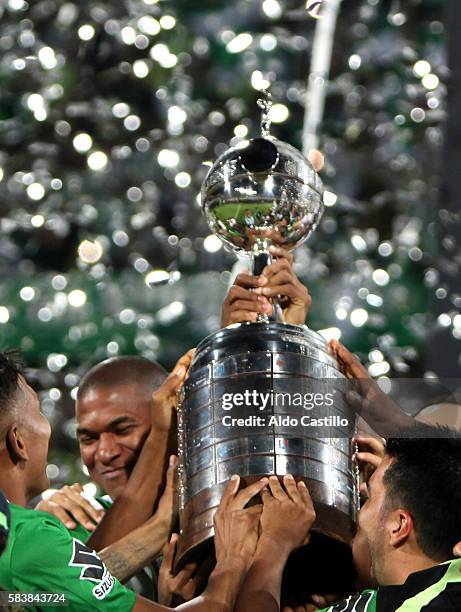 Players of Atletico Nacional celebrate their championship after winning a second leg final match between Atletico Nacional and Independiente del...