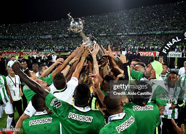 Players of Atletico Nacional celebrate their championship after winning a second leg final match between Atletico Nacional and Independiente del...