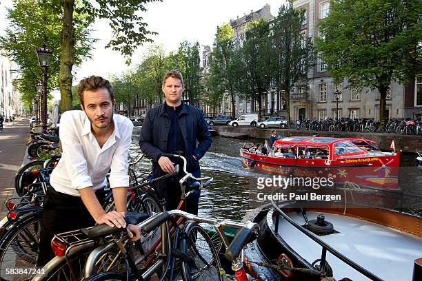 Lead singer Tom Smith and bassist Russell Leetch of British rock band Editors pose for a portrait session by the canal in Amsterdam, Netherlands, 2nd...