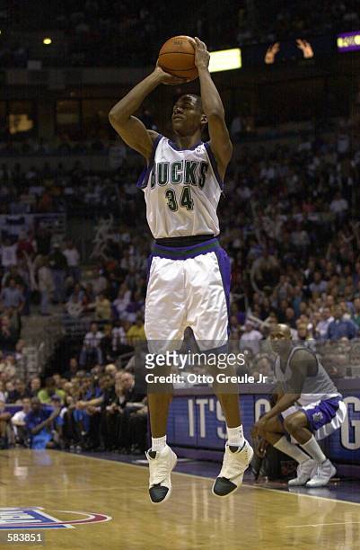 Ray Allen of the Milwaukee Bucks puts a shot up against the Philadelphia 76ers in game six of the eastern conference finals at the Bradley Center in...