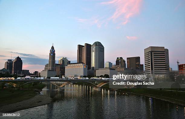 downtown city skyline along the river, columbus, ohio, usa - columbus ohio statehouse stock pictures, royalty-free photos & images