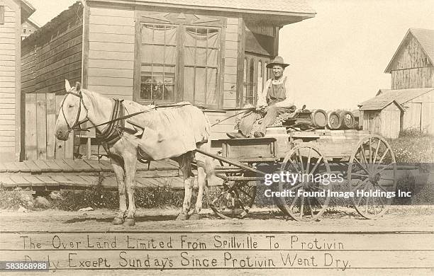 Vintage black and white photograph of a bootlegger on his horse-rrawn cart, ‘The Over Land Limited From Spillville To Protivin Daily Except Sundays...