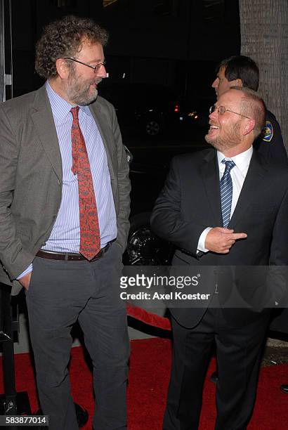 Writer John Carlin, left, and screen writer Anthony Peckham arrive to the Los Angeles premiere of Warner Bros. Pictures' Invictus at the Academy of...