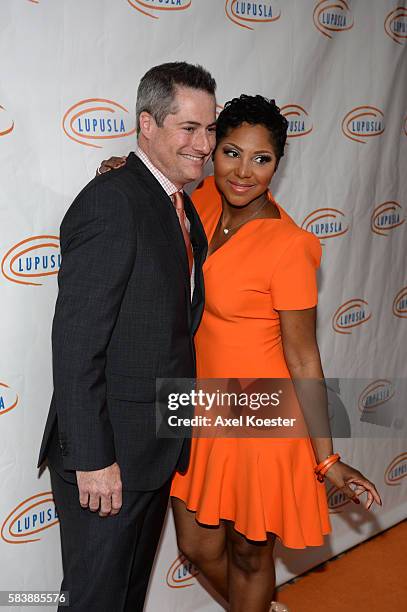 Adam Selkowitz, left, chairman of Lupus LA, and Toni Braxton arrive to the 14th Annual Lupus LA Orange Ball at the Beverly Wilshire Hotel in Beverly...