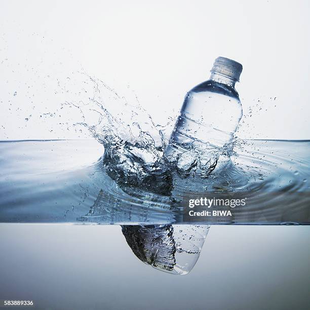 water bottle falling in water - water bottle splash stock pictures, royalty-free photos & images