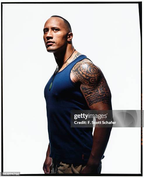 Dwayne "The Rock" Johnson is photographed for Muscle and Fitness Magazine in 2003.