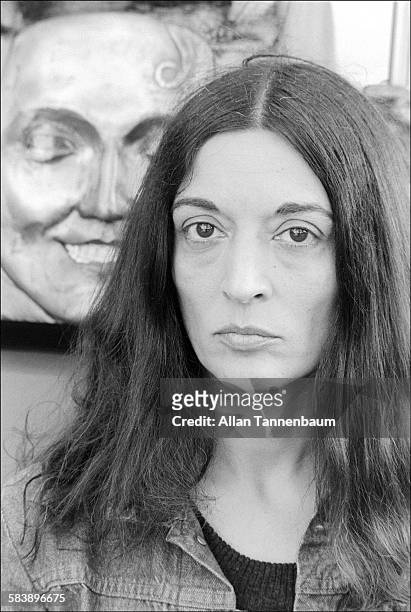 Portrait of French-born artist Marisol Escobar with her sculpture at a park, New Jersey, May 12, 1974.