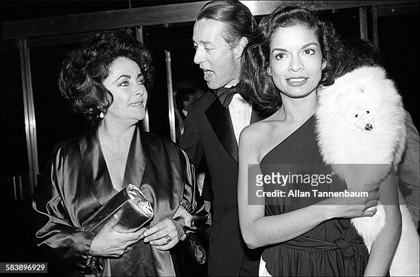 Actress Elizabeth Taylor, fashion designer Halston, and Bianca Jagger, arrive at Studio 54 for Taylor's birthday party, New York, New York, March 6,...