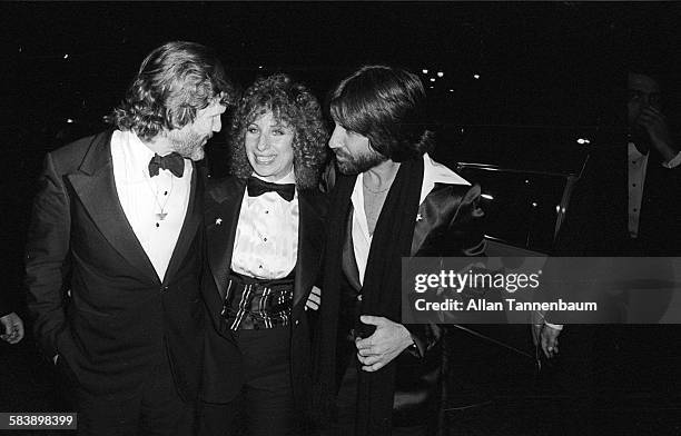 American actors Kris Kristofferson and Barbra Streisand, along with producer Jon Peters arrive for the premiere of their film 'A Star Is Born' at...