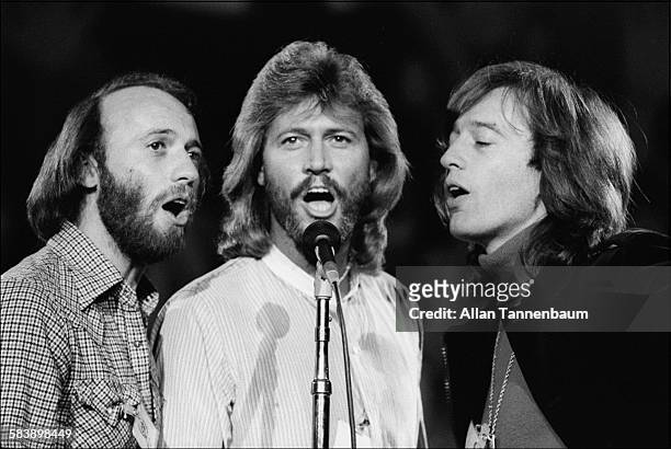 Close-up of music group the Bee Gees, Maurice, Barry, and Robin Gibb, perform at a benefit concert for UNICEF at the United Nations headquarters, New...