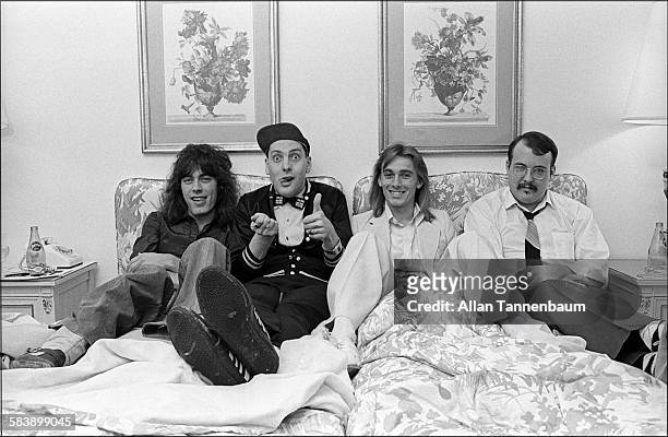 The members of the group Cheap Trick, Tom Petersson, Rick Nielsen, Robin Zander, and Bun E Carlos, in their Park Lane hotel room after an interview,...