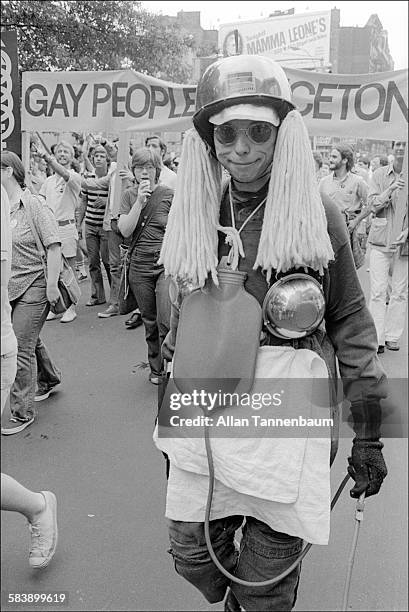 Member of the Penn Enema Club marches past the Stonewall Inn in a Gay Pride Parade, New York, New York, June 29, 1975.