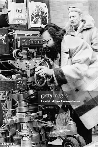 American film director Francis Ford Coppola looks through the camera on the East Village set of his film 'The Godfather Part II', New York, New York,...