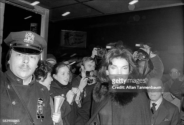 American former First Lady Jacqueline Kennedy Onassis arrives at the premiere of '20th Century,' with Irving 'Swifty' Lazar, New York, New York,...