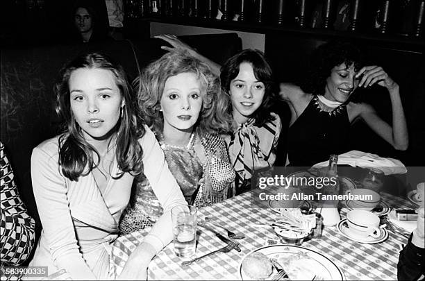 Musician Michelle Phillips and her former stepdaughter, actress Mackenzie Phillips , sit on either side of actress Genevieve Waite, as they attend...