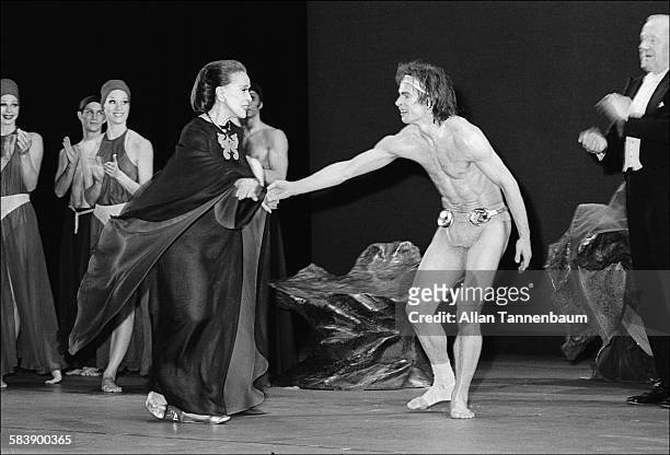 Ballet dancer Rudolph Nureyev welcomes choreographer Martha Graham onstage for the curtain call of her 'Lucifer' on opening night, New York, New...