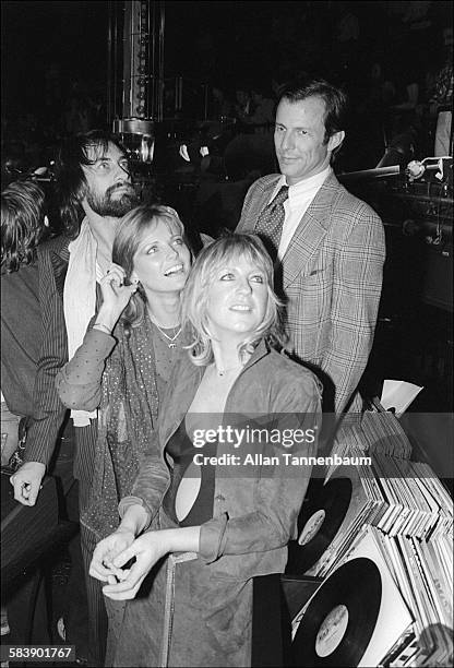 View of British musicians Mick Fleetwood and Christine McVie , both of the group Fleetwood Mac, and American married couple model Cheryl Tiegs and...