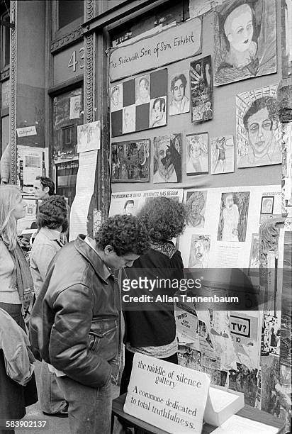 An exhibit of art works related to the 'Son of Sam' on the sidewalk of West Broadway in SoHo, New York, New York, November 14, 1978.