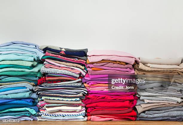 pile of clothes - klädesplagg bildbanksfoton och bilder
