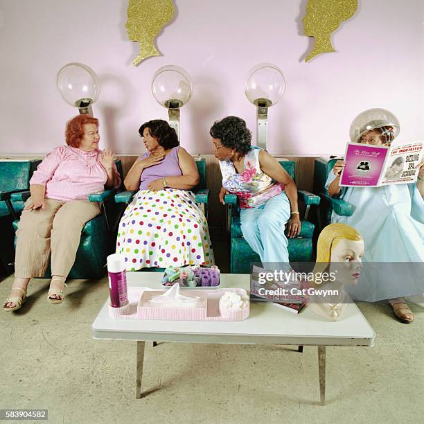 women gossiping at hair salon - rumor stockfoto's en -beelden