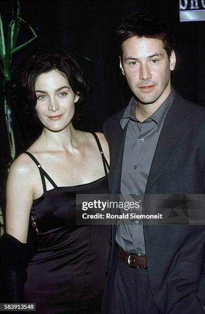 Carrie-Ann Moss and Keanu Reeves.