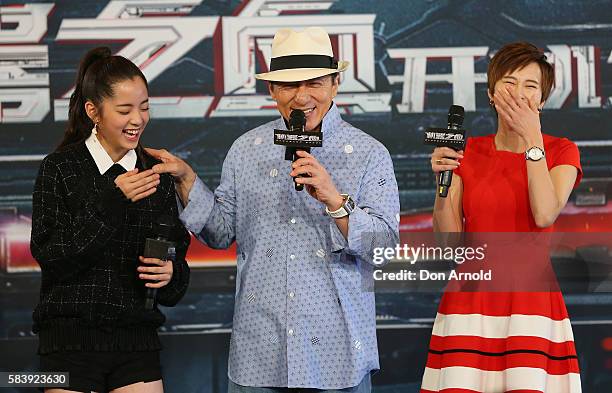 Nana Ouyang and Erica Xia-hou shara laugh as Jackie Chan addresses media during a press conference and photocall for Bleeding Steel at Sydney Opera...