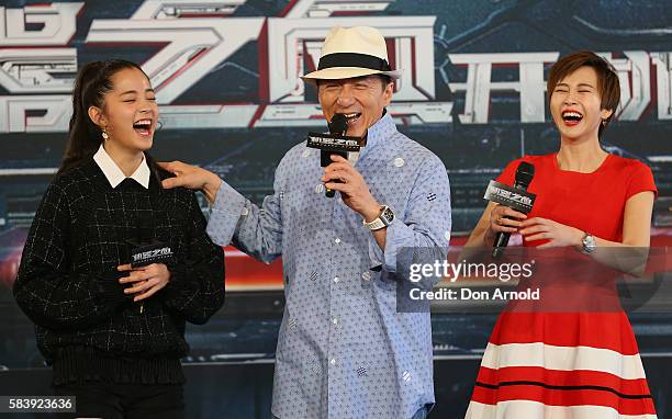 Nana Ouyang and Erica Xia-hou shara laugh as Jackie Chan addresses media during a press conference and photocall for Bleeding Steel at Sydney Opera...