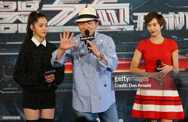 Nana Ouyang and Erica Xia-hou look on as Jackie Chan addresses media during a press conference and photocall for Bleeding Steel at Sydney Opera House...
