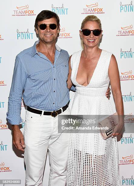 Actor Grant Show and actress Katherine LaNasa arrive at the Raising The Bar To End Parkinson's event at Laurel Point on July 27, 2016 in Studio City,...
