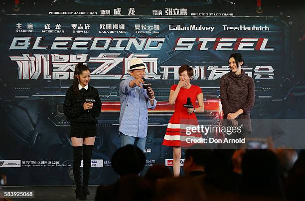 Nana Ouyang,Erica Xia-hou and Tess Haubrich share a laugh as Jackie Chan addresses media during a press conference and photocall for Bleeding Steel...
