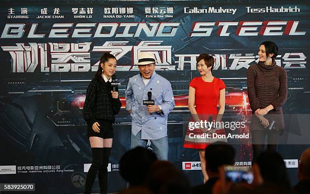 Nana Ouyang,Erica Xia-hou and Tess Haubrich share a laugh as Jackie Chan addresses media during a press conference and photocall for Bleeding Steel...